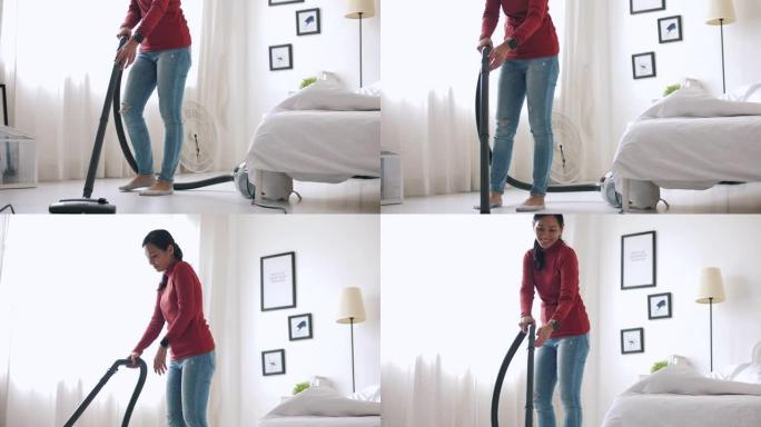 特写女性真空吸尘器清洁地毯，房屋清洁