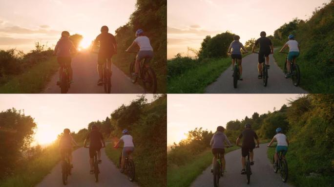 镜头耀斑: 无法识别的骑自行车的人在金色日落时沿着空旷的道路踩踏板。