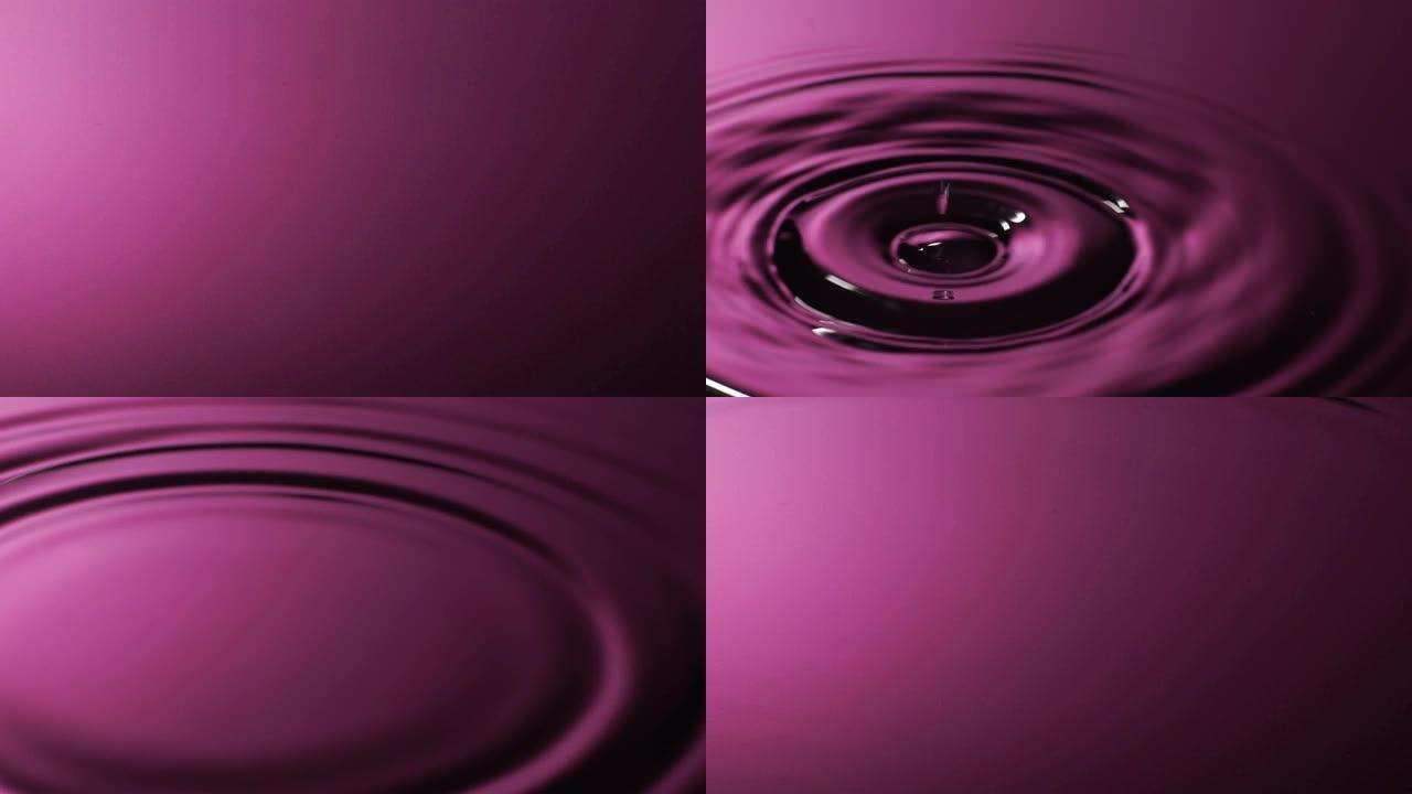 慢动作: 水滴变成粉红色的水。