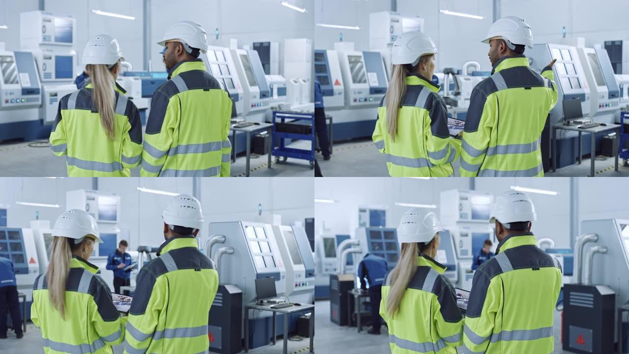 工业4.0工厂: 总工程师和项目主管在安全背心和安全帽，交谈，使用数字平板电脑，屏幕显示新引擎的3D