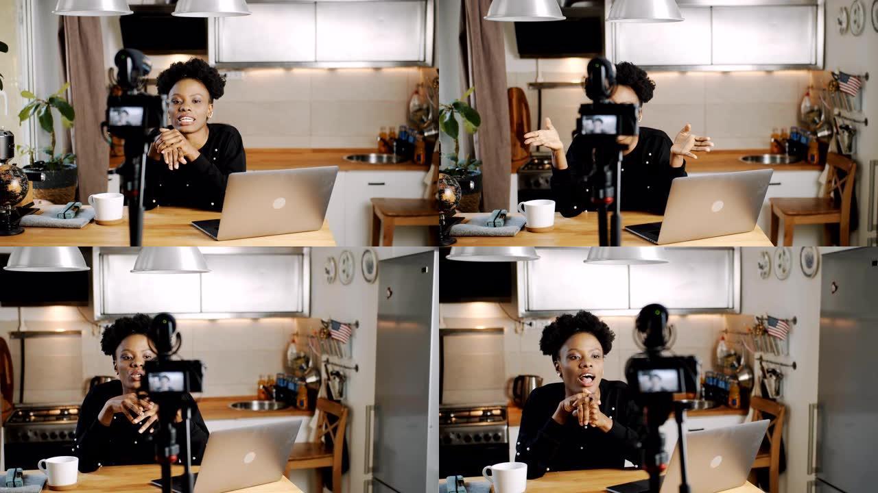 快乐年轻美丽的黑人生活方式博主女人在家用相机慢动作制作新的娱乐视频。