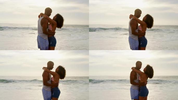 非裔美国夫妇在海滩上一起跳舞的侧视图4k