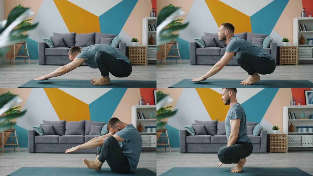 男瑜伽学生在家做脊椎伸展运动的慢动作