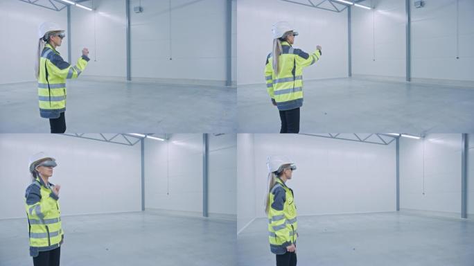 行业4.0工厂: 女工程师佩戴增强现实耳机使用混合现实软件，手势为未来机械制造车间地板，工厂地板布局