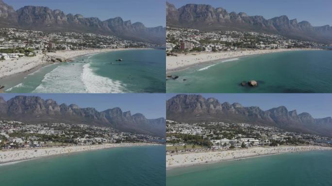 南非开普敦，坎普湾海滩的4k鸟瞰图，背景是12个使徒山