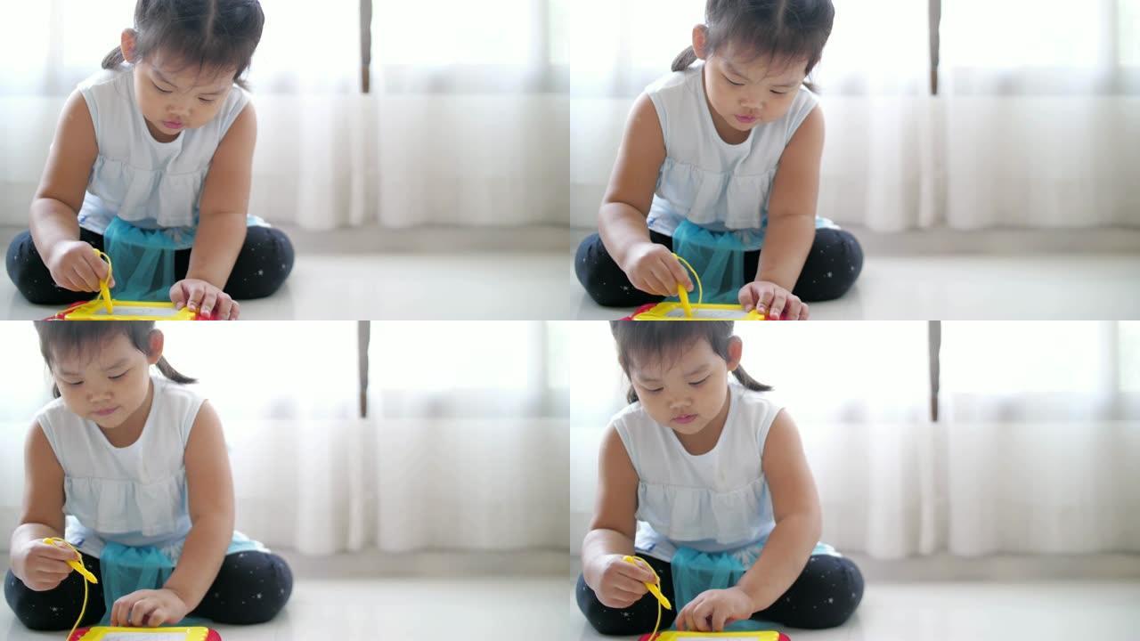 小女孩用玩具写作，慢动作