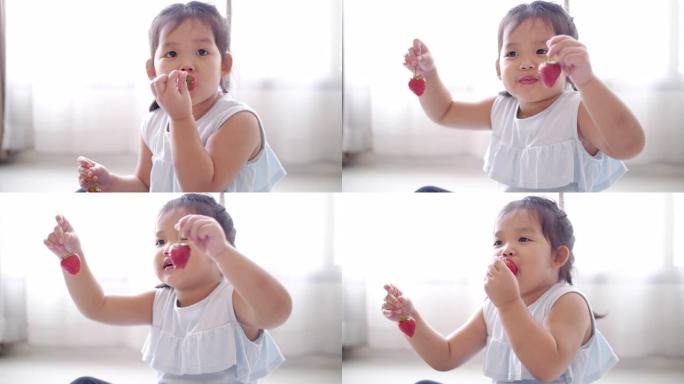 小女孩开心，喜欢在家吃草莓