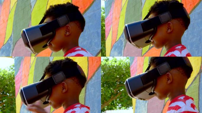 非裔美国男生在学校操场上使用虚拟现实耳机的侧视图4k