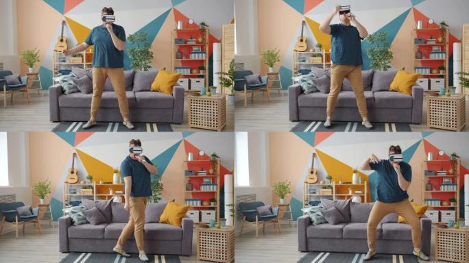 有创意的男人在家中戴着虚拟现实眼镜在遥控器中唱歌