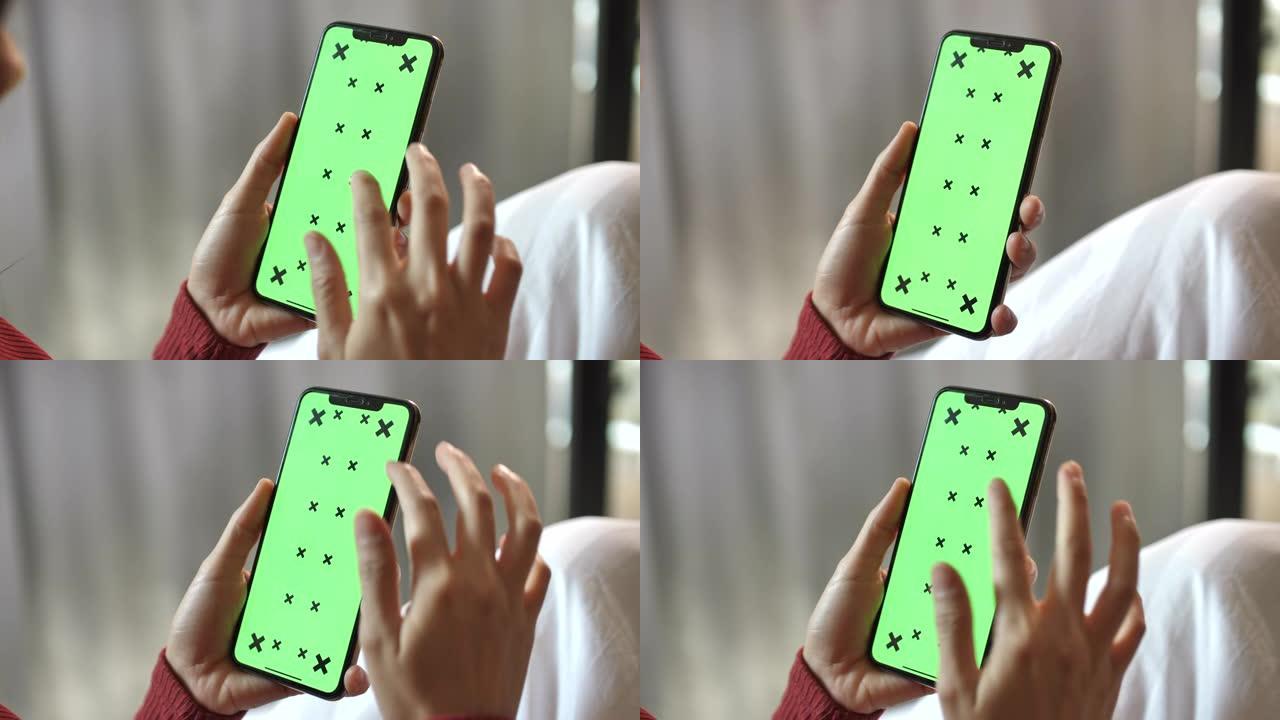 特写少妇使用绿屏智能手机