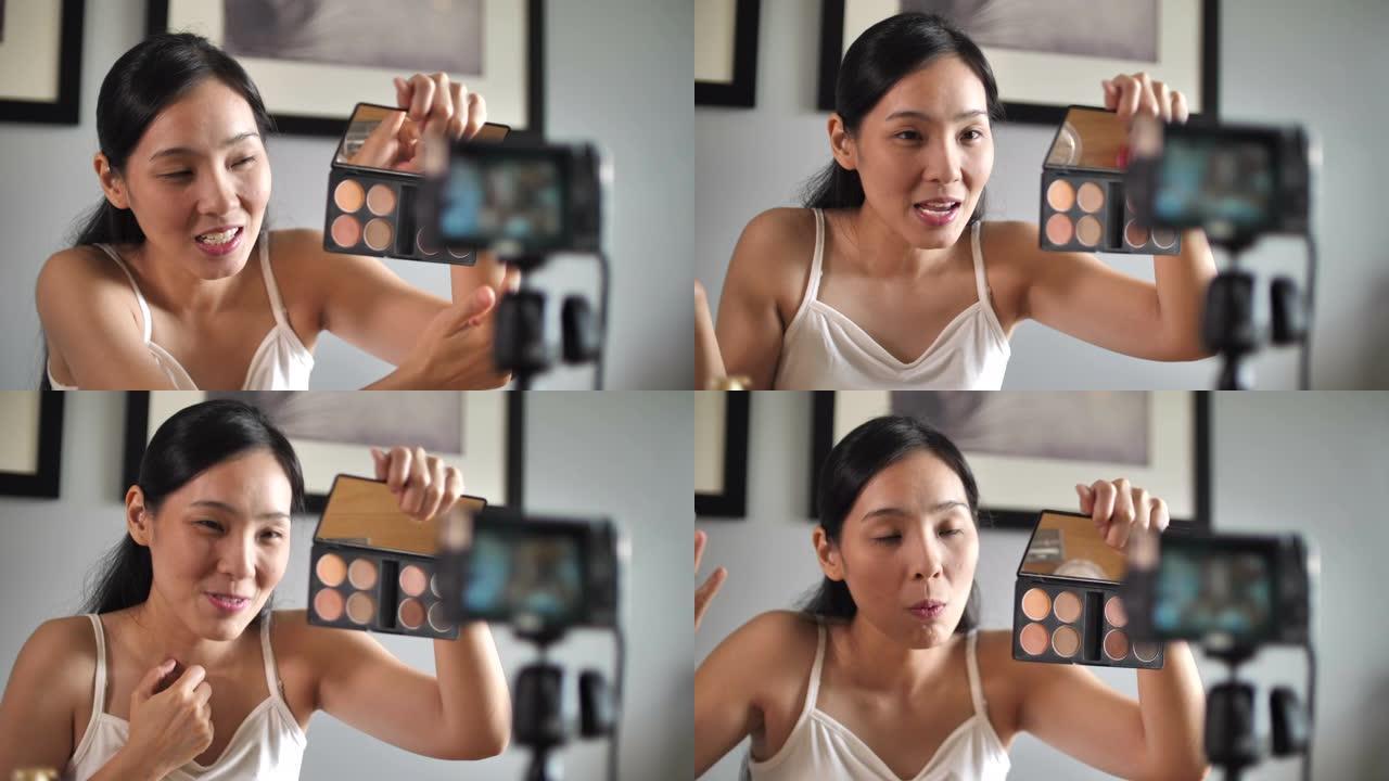 亚洲年轻女性博主在家录制带化妆化妆品的Vlog视频