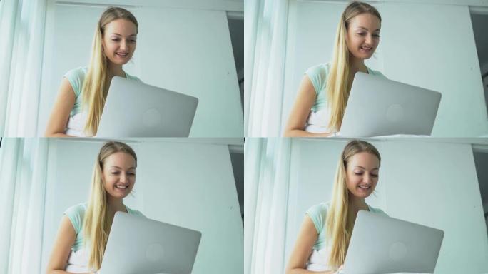 金发女人使用笔记本电脑