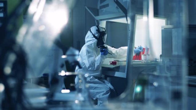 人在实验室工作时戴危险品。冠状病毒，新型冠状病毒肺炎，2019-ncov药物研究概念。