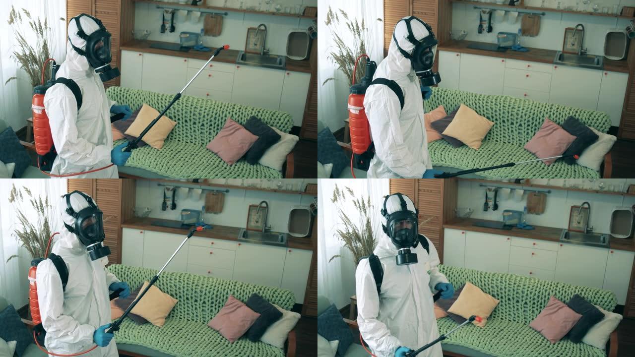 工人在检疫期间消毒房间时使用喷雾器。Covid19，冠状病毒预防概念。