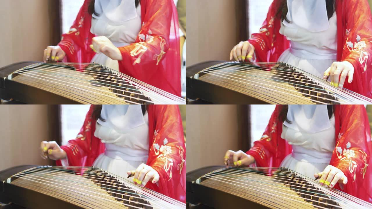 女人演奏中国传统乐器，美丽而旋律的古镇