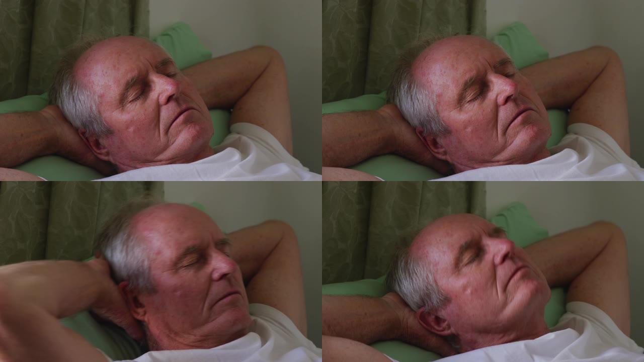 在退休之家睡觉的社交距离中的高级男子