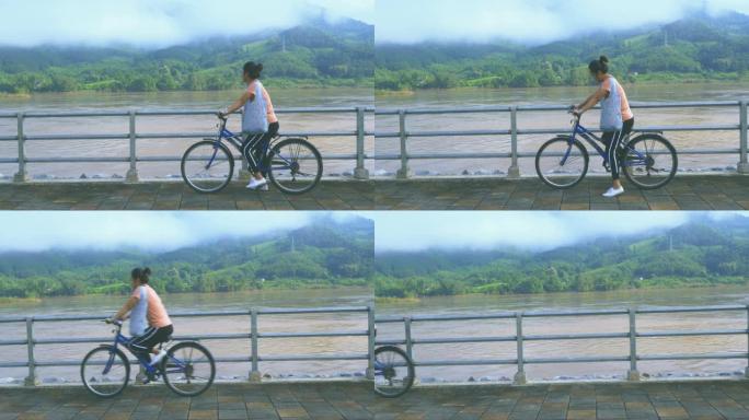 老挝/湄公河: 女孩骑自行车
