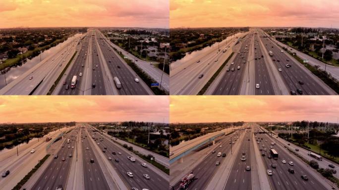 美国佛罗里达州迈阿密日落时，WS鸟瞰图汽车沿着高速公路行驶