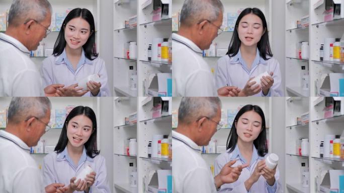 亚洲年轻女药剂师建议在药品商店的一名老人患者开药。专业，医学和保健，医学教育，制药部门，科学，咨询，