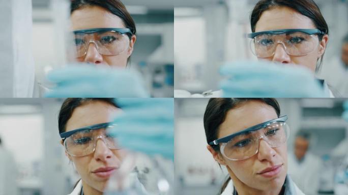 用移液器分析液体提取实验室试管中的DNA和分子的女科学家肖像。