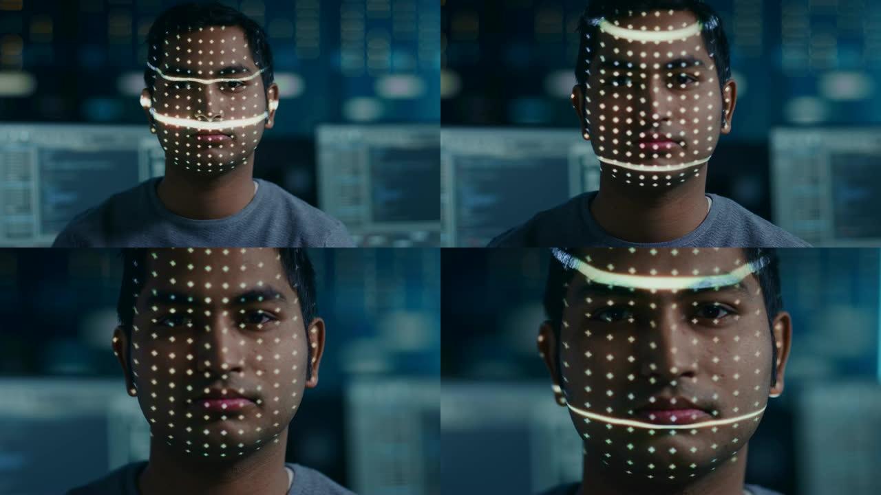 英俊的年轻印度男子通过生物识别面部识别扫描过程进行识别。未来派概念: 投影仪通过点照明面部并用激光扫