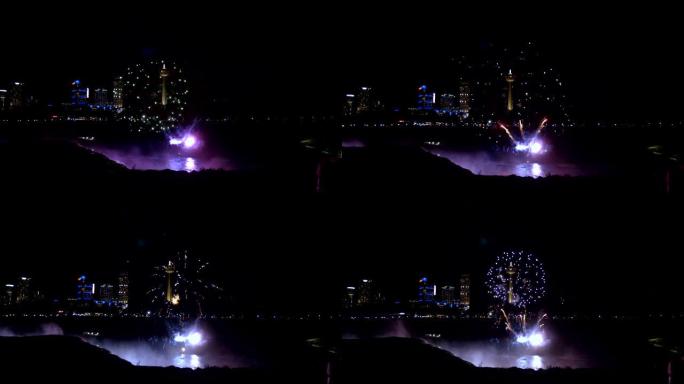 尼亚加拉瀑布8月17日2018美丽的烟花在夜间瀑布和照明建筑慢动作中爆炸。