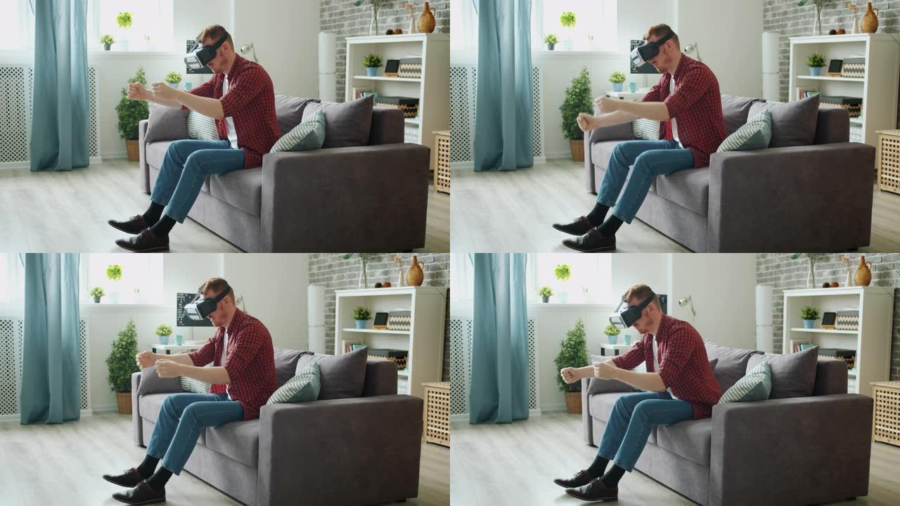 在虚拟现实眼镜中享受驾驶活动的成年男性在家打手势