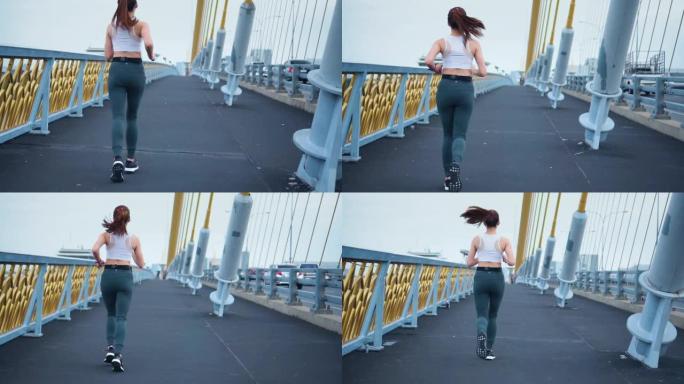 年轻女子慢跑过桥，慢动作