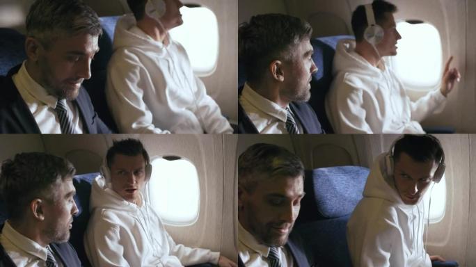 商人在飞机上与傲慢的乘客交谈