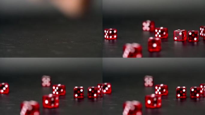 真正的慢动作在黑色背景上扔许多红色骰子