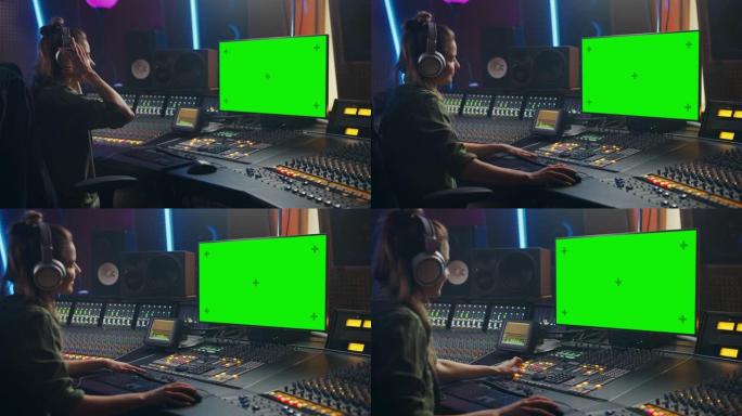 在音乐唱片工作室工作的时尚女性音频工程师/制作人，使用耳机、绿屏电脑显示器、混音板、控制台创作新歌。
