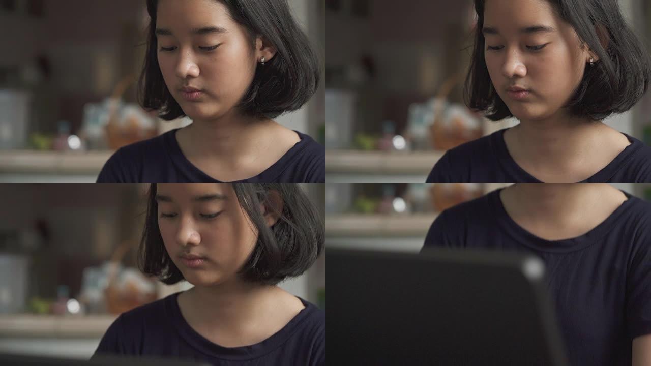 年轻的亚洲女孩在钢琴课上练习手