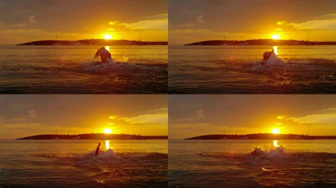 MS超级慢动作男子在日落时分跳入宁静的海洋，克罗地亚佩列萨克