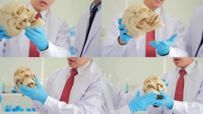 在生命科学实验室工作的卫生保健研究人员人体骨骼模型。