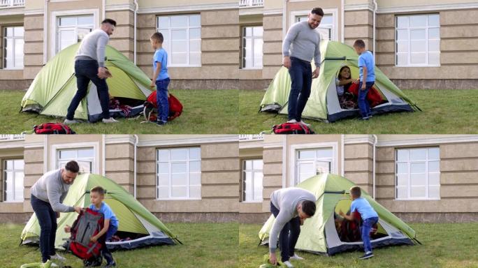 创造性的高加索家庭假装在后院露营