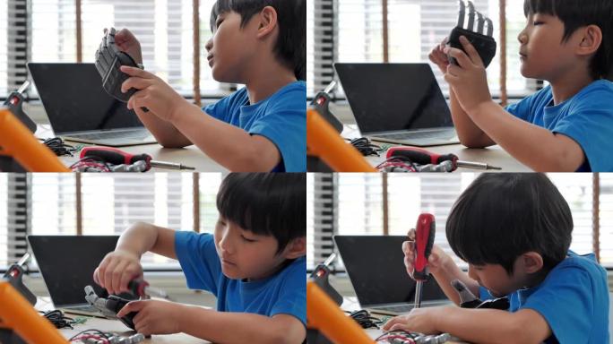 男孩在家中使用计算机进行构建和编程，并将其作为学校科学项目来构建机器人手臂。他对s work.edu