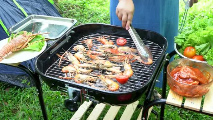 烧烤，海鲜烤虾和螃蟹在假日营地