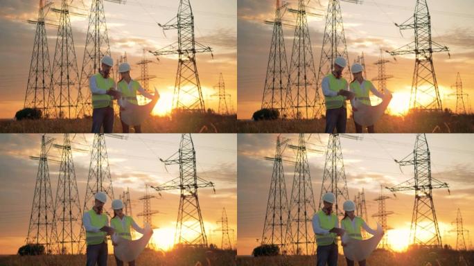 电力线工人在日落背景下执行施工计划。