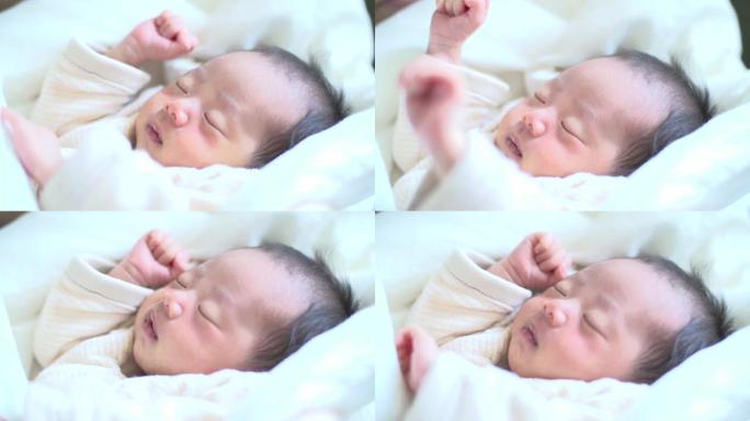 熟睡的亚洲新生儿胎儿新生产科中心月子中心