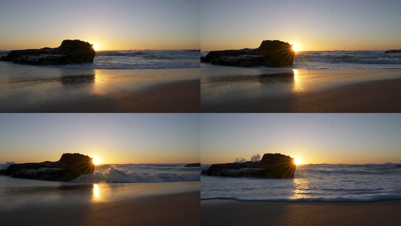 葡萄牙大西洋沿岸美丽的沙滩。太阳被视为一颗从岩石外闪耀的多波束恒星。UHD