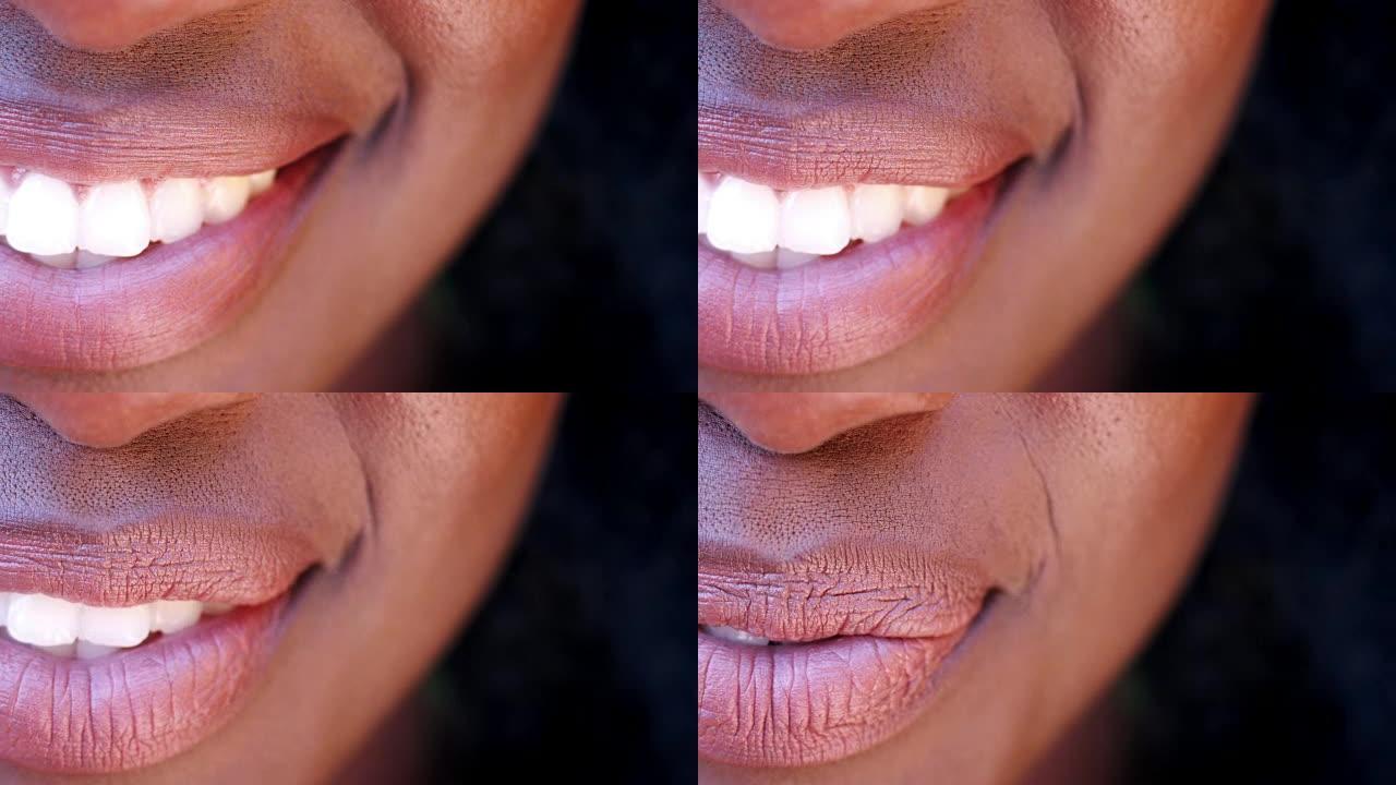 微笑的黑人妇女关闭嘴的一侧，细节
