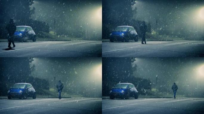 男子在寒冷的下雪天气中走在道路上