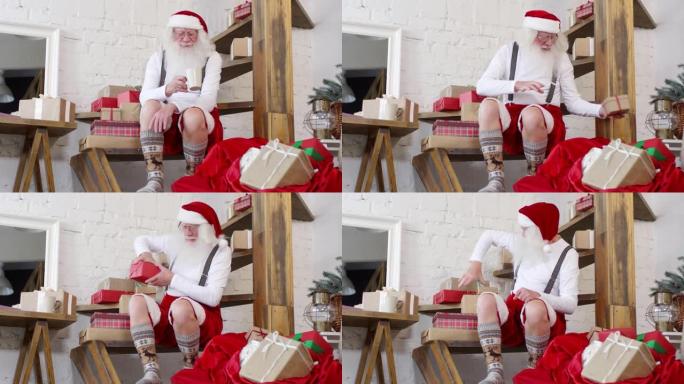 圣诞老人在家喝茶和打包礼物