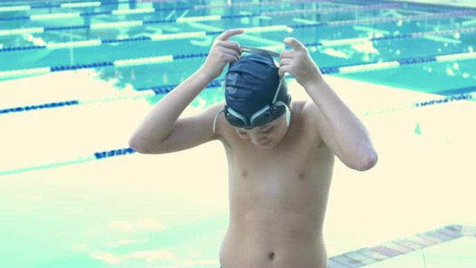 泳池男孩戴上泳镜泳池男孩戴上泳镜