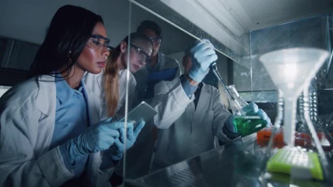 科学家的肖像正在对试管中的DNA和分子进行分析，并在实验室中显示出结果