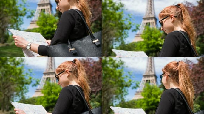 游客手持巴黎城市地图，站在埃菲尔铁塔前