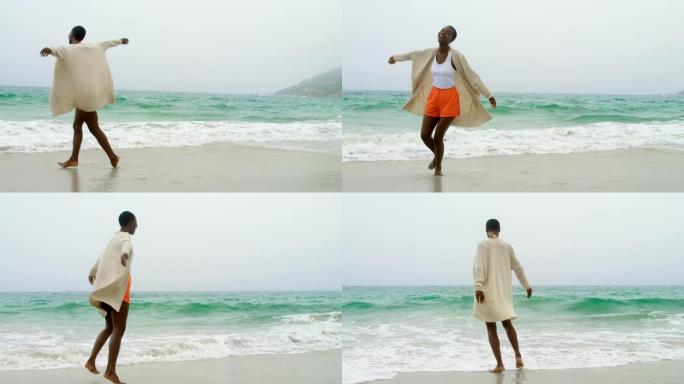 年轻的非洲裔美国妇女在海滩上跳舞4k