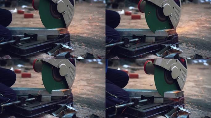 4k镜头场景手的特写镜头使用角磨机在金属工厂、工业和机器概念中切割和研磨金属的钢零件