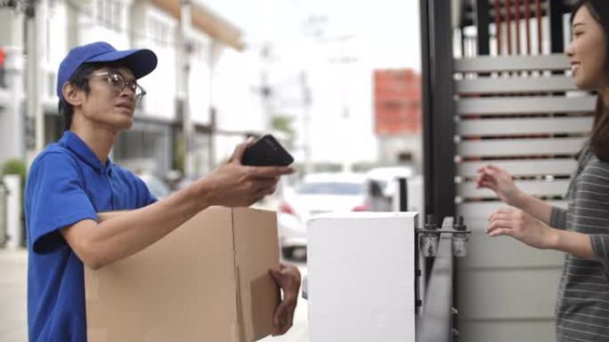 送货员将包裹箱运送到客户家中，并通过在智能手机上签名进行接收