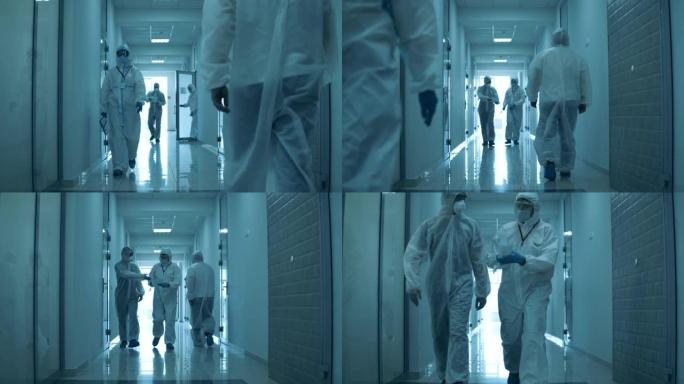 许多医生在冠状病毒大流行期间在医院工作，走在走廊上。